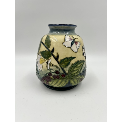 315 - A Moorcroft Fruit Garden pattern vase designed by Nicola Slaney - approx. 14cm high