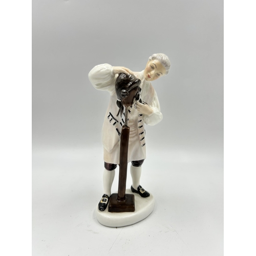 320 - A Royal Doulton The Wigmaker of Williamsburg figurine - HN 2239