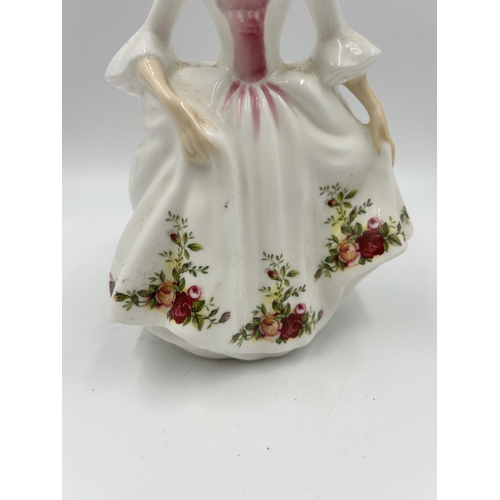 327 - A Royal Doulton Country Rose figurine - HN 3221