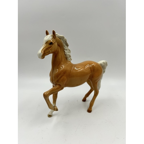 344 - Two Beswick palomino horse figurines