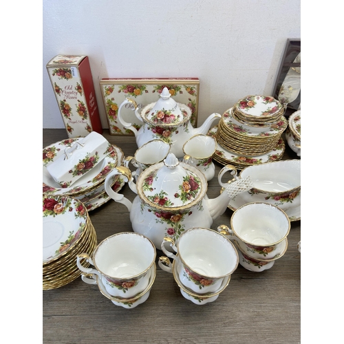 353 - A large collection of Royal Albert Old Country Roses china to include two lidded tureens, two teapot... 