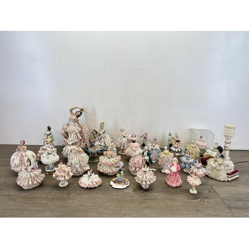 362 - A collection of mainly Dresden porcelain lace figurines