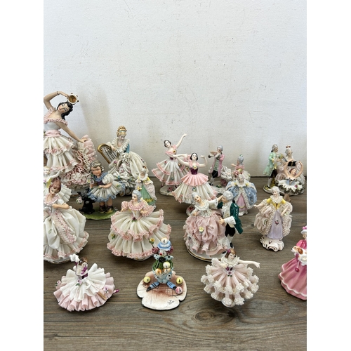 362 - A collection of mainly Dresden porcelain lace figurines