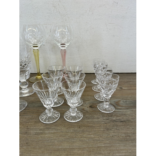 372 - A collection of cut crystal glassware to include set of four Stuart sherry glasses, ten Stuart stemm... 