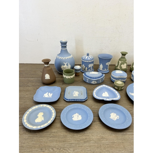 384 - A collection of Wedgwood Jasperware to include cup and saucer, decanter and stopper etc.