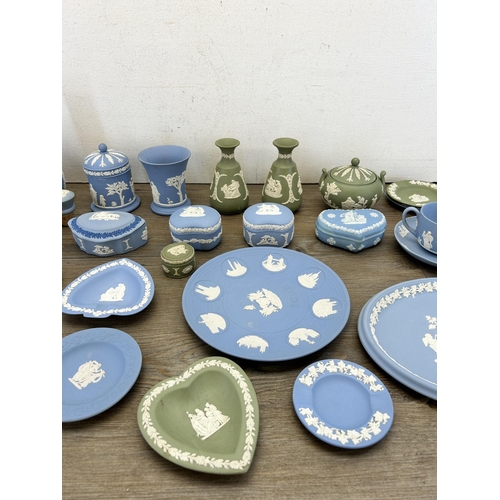 384 - A collection of Wedgwood Jasperware to include cup and saucer, decanter and stopper etc.