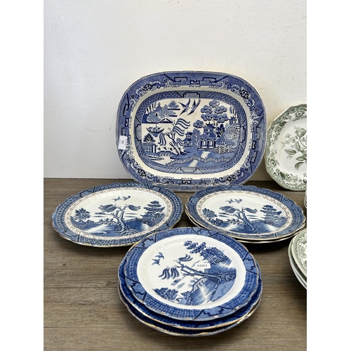 387 - A collection of ceramic plates and dishes to include Booths Real Old Willow, Copeland Rd No. 180 etc... 