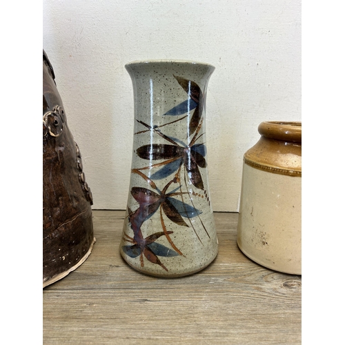 393 - Five pieces of stoneware pottery to include three salt glazed storage jars, Ireland Pottery Anglesey... 