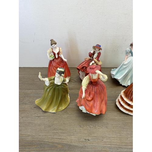 399 - Nine ceramic figurines, six Royal Doulton and three Coalport