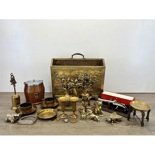 409 - A collection of metalware to include brass two section magazine rack, Middle Eastern engraved brassw... 