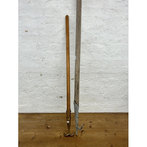 413 - Two antique boat hooks, one brass tip and one with galvanised tip