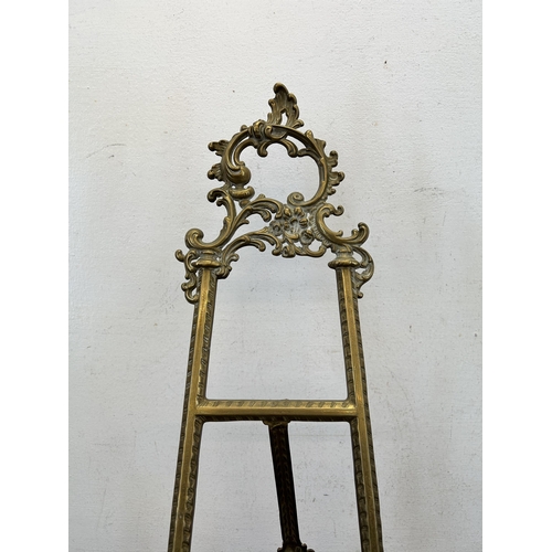 414 - A Rococo style gilt metal easel - approx. 54cm high x 27cm wide