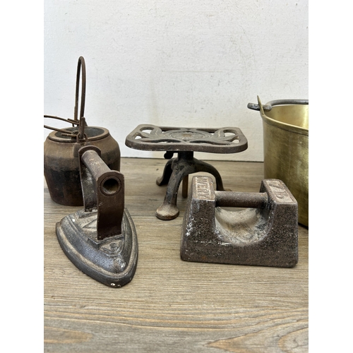 415 - Six pieces of 19th century and later metalware to include Spong cast iron trivet stand, Groenlandica... 