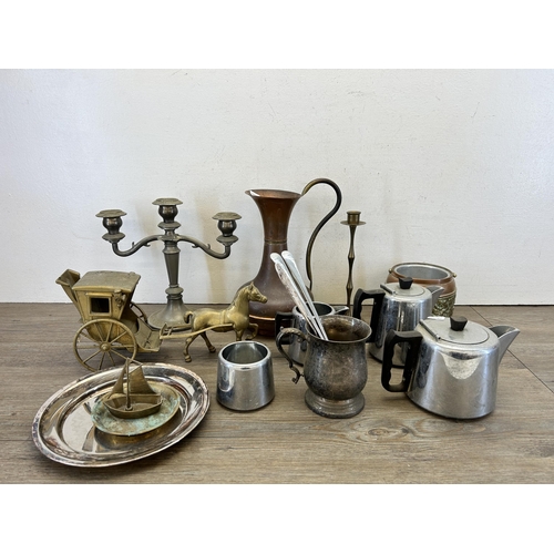 416 - A collection of 19th century and later metalware to include copper and brass water jug, silver plate... 