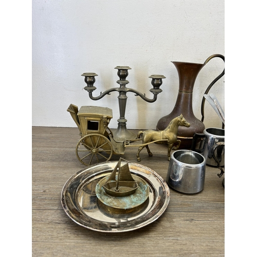 416 - A collection of 19th century and later metalware to include copper and brass water jug, silver plate... 