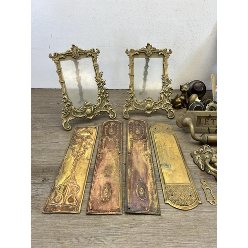 417 - A collection of 19th century and later metalware to include brass letterbox, pair of Rococo style br... 