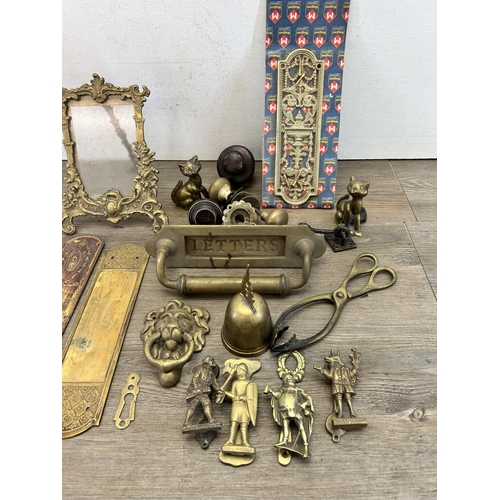 417 - A collection of 19th century and later metalware to include brass letterbox, pair of Rococo style br... 