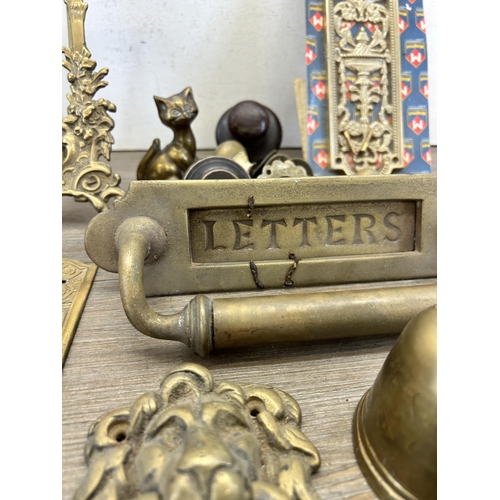 417 - A collection of 19th century and later metalware to include brass letterbox, pair of Rococo style br... 