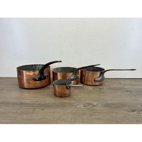 418 - Five pieces of late 19th/early 20th century copper kitchenware, one colander and four graduating sau... 