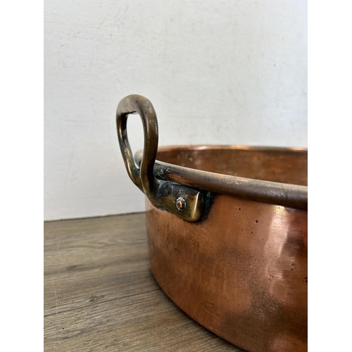 419 - A large Victorian copper twin handled preserve pan - approx. 20cm high x 43cm diameter