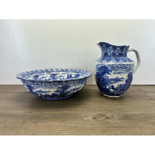 366A - An antique Cauldon England blue and white transfer printed water jug and bowl with horse and chariot... 