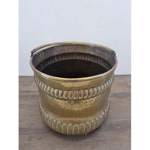 426 - A late 19th/early 20th century Middle Eastern engraved brass coal scuttle - approx. 30cm high x 33cm... 