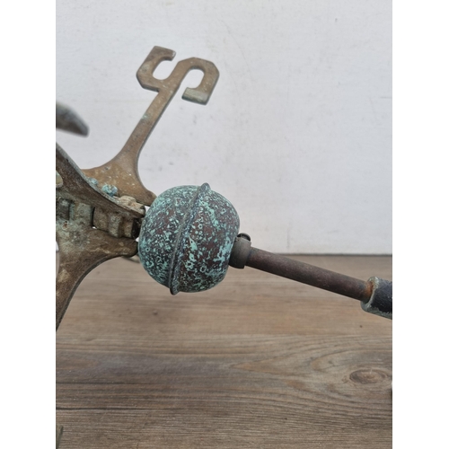 428 - A cast metal and copper weathervane in the form of a bird in flight - approx. 70cm high