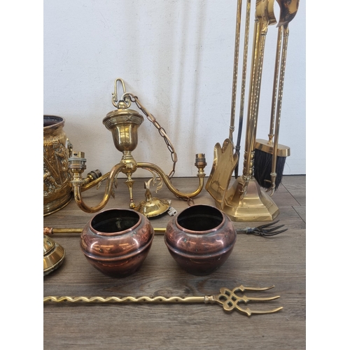 430 - A collection of metalware to include embossed brass coal bucket, brass three branch chandelier, six ... 