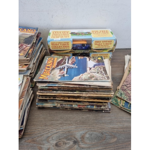 440 - A collection of vintage toys and magazines to include a large collection of 1950s Meccano magazines,... 