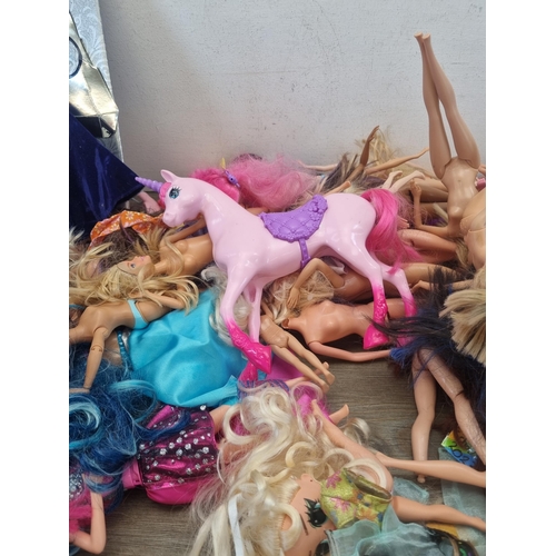 441 - A large collection of dolls and figurines to include Barbie, Disney Frozen, Mattel, Barbies Vespa et... 