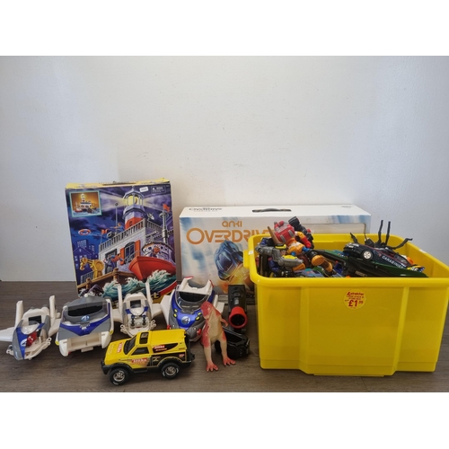 442 - A large collection of action figurines and model vehicles to include Hasbro Tonka Racing Hornet, Mar... 