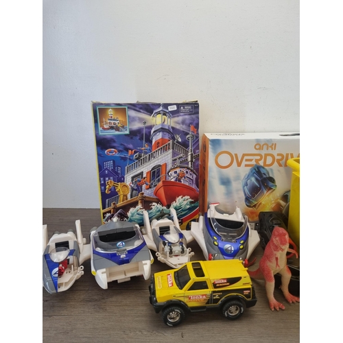 442 - A large collection of action figurines and model vehicles to include Hasbro Tonka Racing Hornet, Mar... 