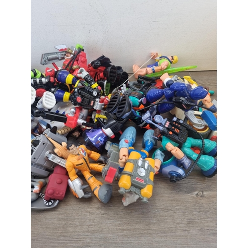 442 - A large collection of action figurines and model vehicles to include Hasbro Tonka Racing Hornet, Mar... 