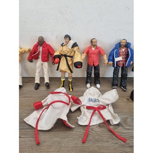 446 - A collection of MGM Studios Jakks Pacific Inc. Rocky action figures to include Rocky, Paulie, Micky ... 