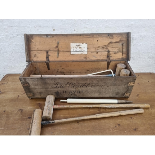 448 - A late 19th/early 20th century F.H Ayres The Wimbledon croquet set with original pine box