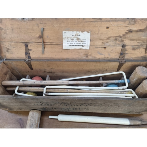 448 - A late 19th/early 20th century F.H Ayres The Wimbledon croquet set with original pine box