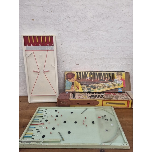 453 - A collection of vintage games to include boxed Marx Pro Shot Golf putting set, boxed Ideal Tank Comm... 