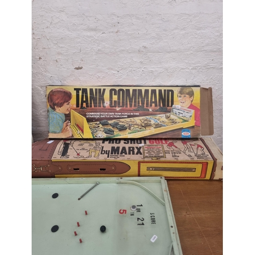 453 - A collection of vintage games to include boxed Marx Pro Shot Golf putting set, boxed Ideal Tank Comm... 