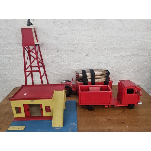 454 - A collection of scratch built and hand painted wooden models to include two trucks, one crane tower ... 