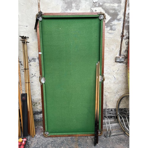 727 - A 6ft pool table with three cues and triangle