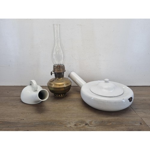 433A - Three items, one mid 20th century enamel bed warming pan, one mid 20th century brass oil lamp and on... 