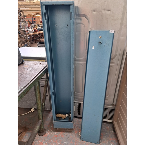 766C - An industrial cast metal gun cabinet - approx. 135cm high x 23cm wide x 21cm deep