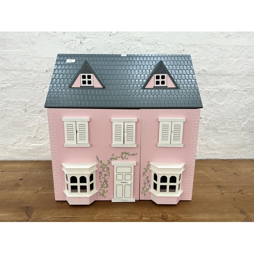 458 - A wooden two door doll's house with accessories - approx. 62cm high x 61cm wide x 42cm deep