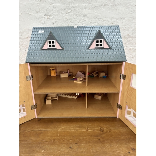 458 - A wooden two door doll's house with accessories - approx. 62cm high x 61cm wide x 42cm deep