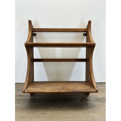 512 - A mid 20th century Ercol elm wall mountable two tier waterfall bookshelf - approx. 52cm high x 43cm ... 