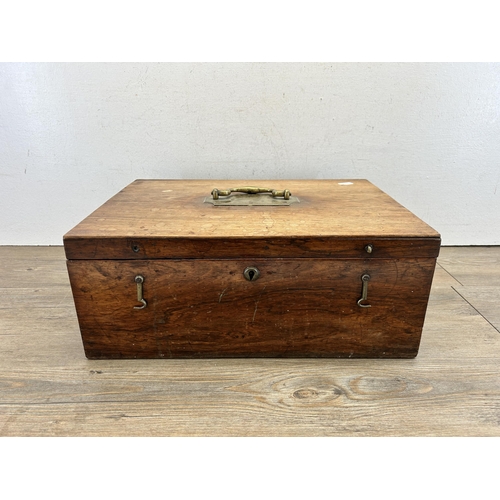 513 - A 19th century rosewood storage box with brass handle and escutcheon - approx. 17cm high x 42cm wide... 