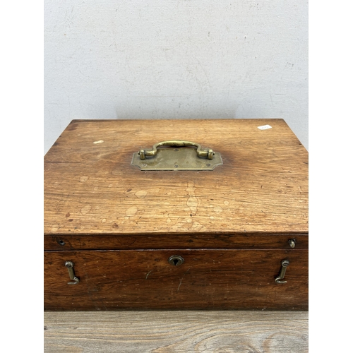 513 - A 19th century rosewood storage box with brass handle and escutcheon - approx. 17cm high x 42cm wide... 