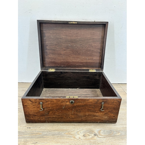 513 - A 19th century rosewood storage box with brass handle and escutcheon - approx. 17cm high x 42cm wide... 