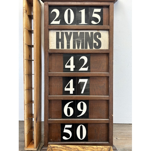 522 - Three early 20th century and later items, one oak hymns board, one oak rectangular tray and one pine... 