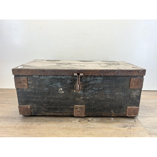 529 - A 19th century ebonised pine and metal banded rectangular storage box